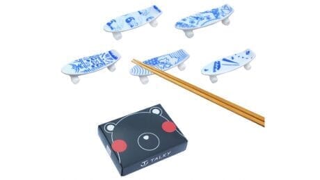 Charity skateboard chopstick rests by 20 artists are now on sale.