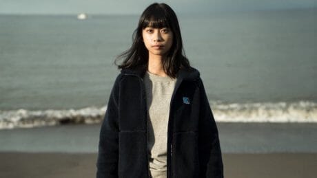 What kind of material was developed by Helly Hansen to resist the harsh cold of the sea?