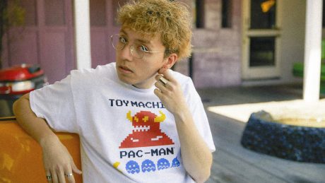 This is what we mean by a T-shirt that looks great even when worn alone. Pac-Man and Monster logos on an 8-bit graphic T-shirt.