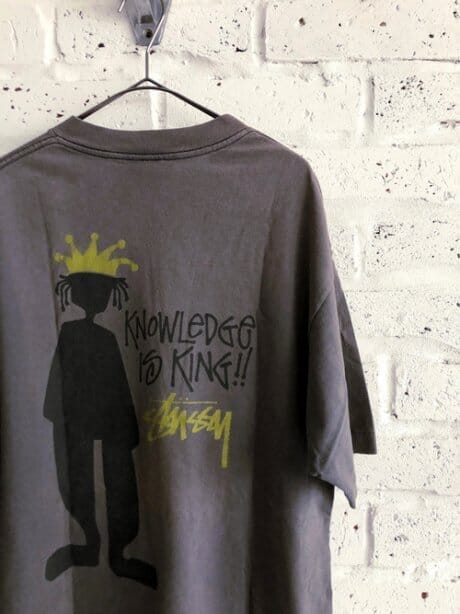 A ubiquitous, Old Stussy T-shirt. And it's made in the U.S.A. .