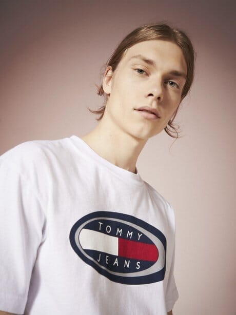 The original. Tommy Jeans' summer collection is in full 90's style.