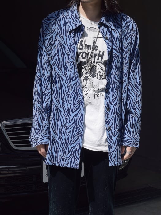 A blue zebra print shirt that you want to wear until it's crumbly.