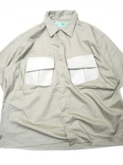 Red cap work shirt with military elements. The tailoring is decadent.