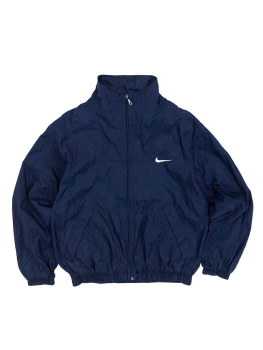 Convenient to throw on and throw off quickly. Nike's nylon jackets never go out of style.