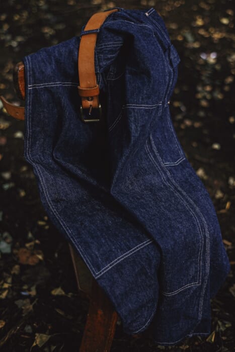 Comolli and reshop. Double-knee denim pants that are both flexible and tough.