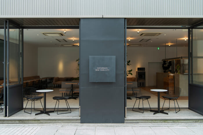 Saturdays New York City Kobe's café space has been renovated. It has been transformed into a community space that condenses the brand's identity.