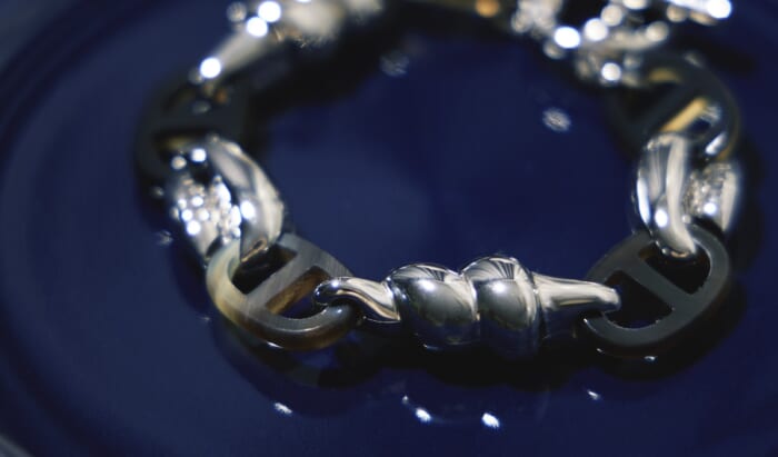 Hermes bracelet made of chains and shells found on the seashore.