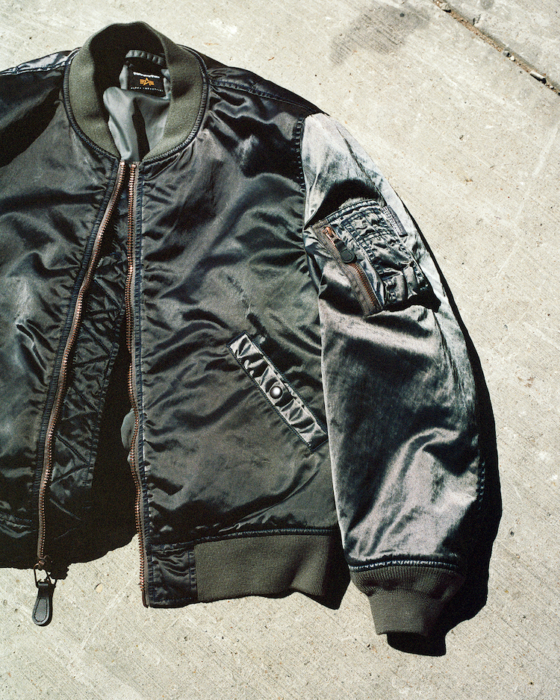 ディスイズネバーザットがアルファ インダストリーズとコラボ。ナイジェルグラフがイラストを手がけたアイテムもあるよ。