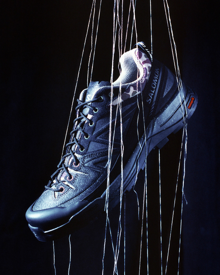 Signature camouflage pattern accents. New Salomon x Carhartt WIP footwear is available today.