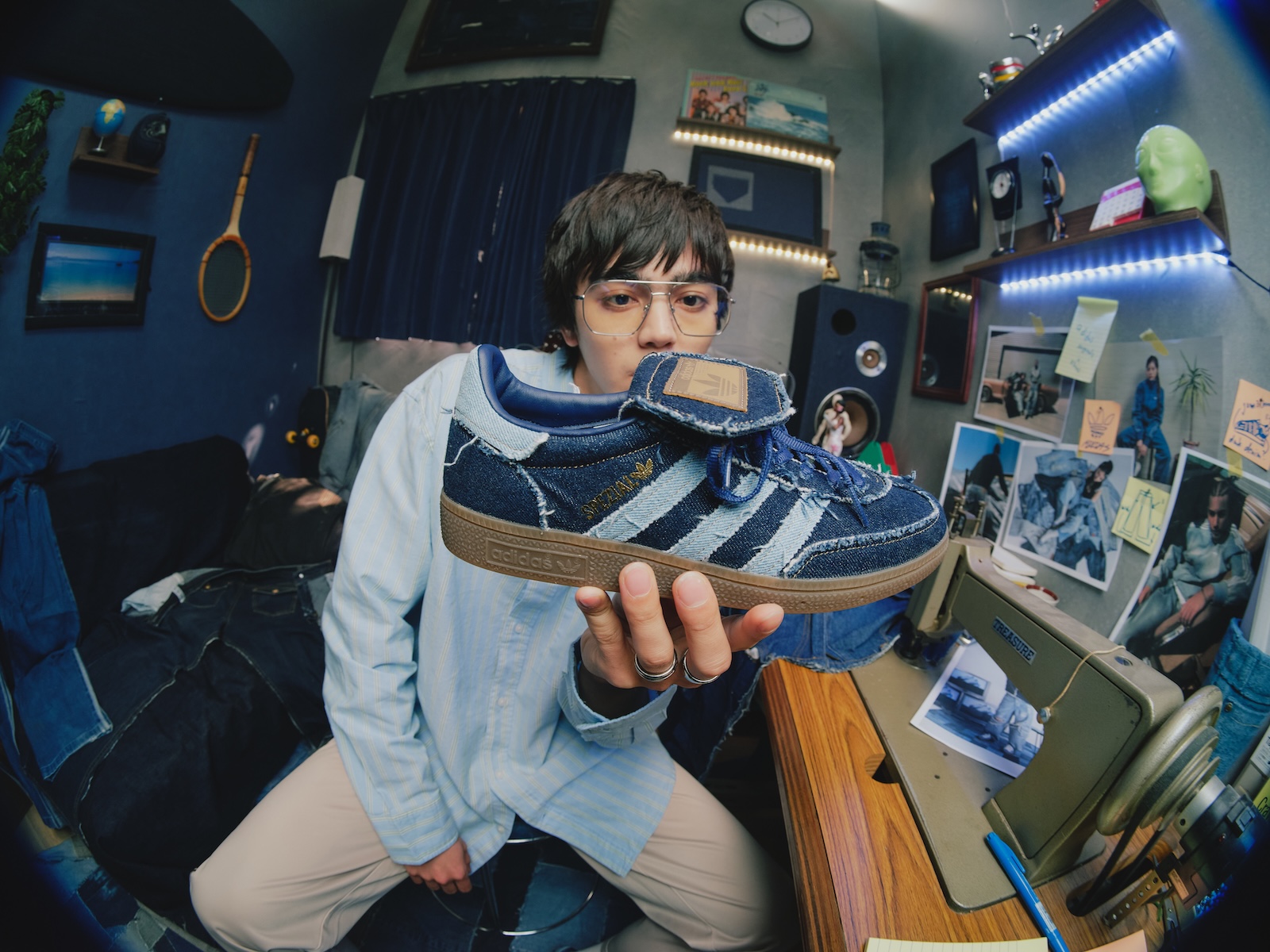 Atmos has given a bold twist to a classic Adidas model. This eye-catching denim-clad design is now available for both men and women.